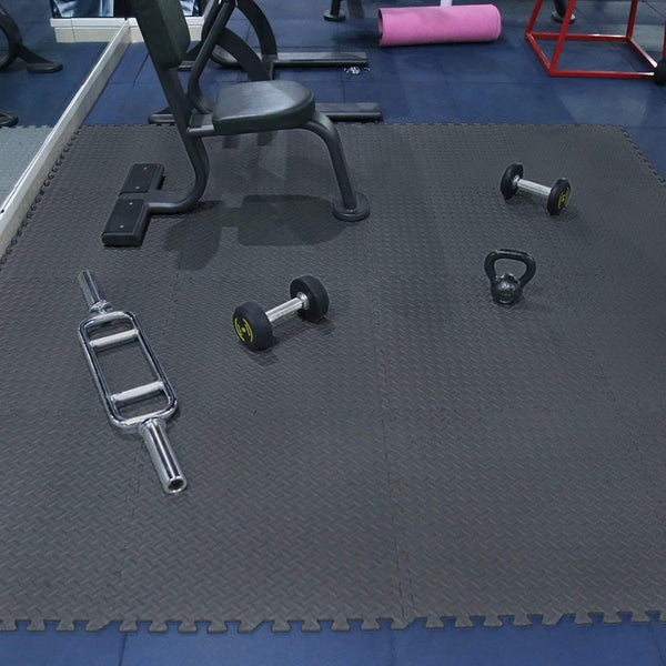 Interlocking matting beneath gym equipment