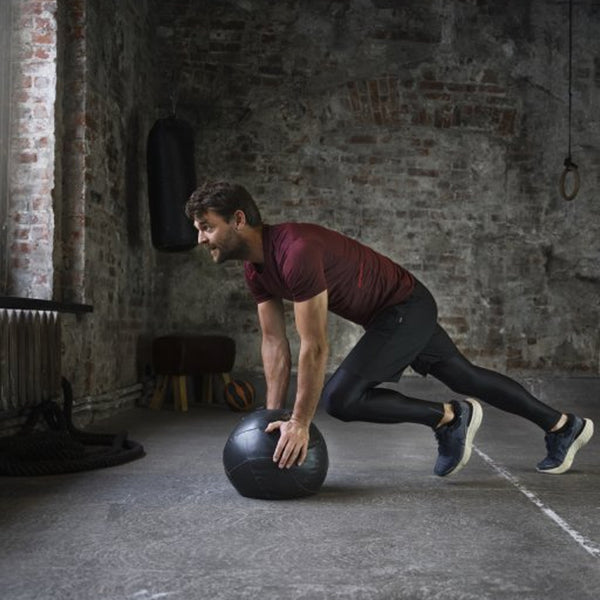 Person training with a wall ball