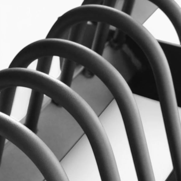 Close-up of weight plates in a horizontal rack