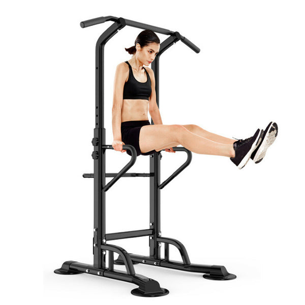 Person exercising on a pull-up and dip station