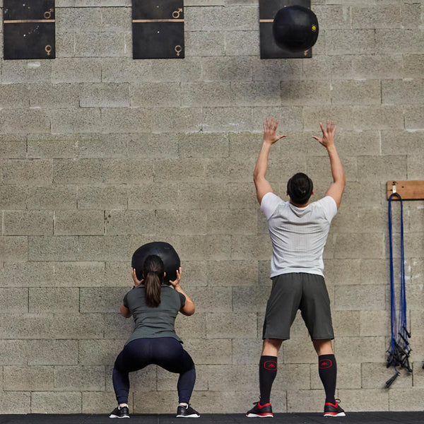 Person training with a wall ball