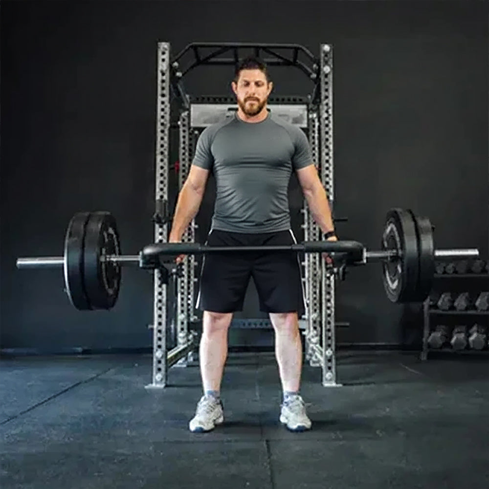 Person exercising with an open trap bar
